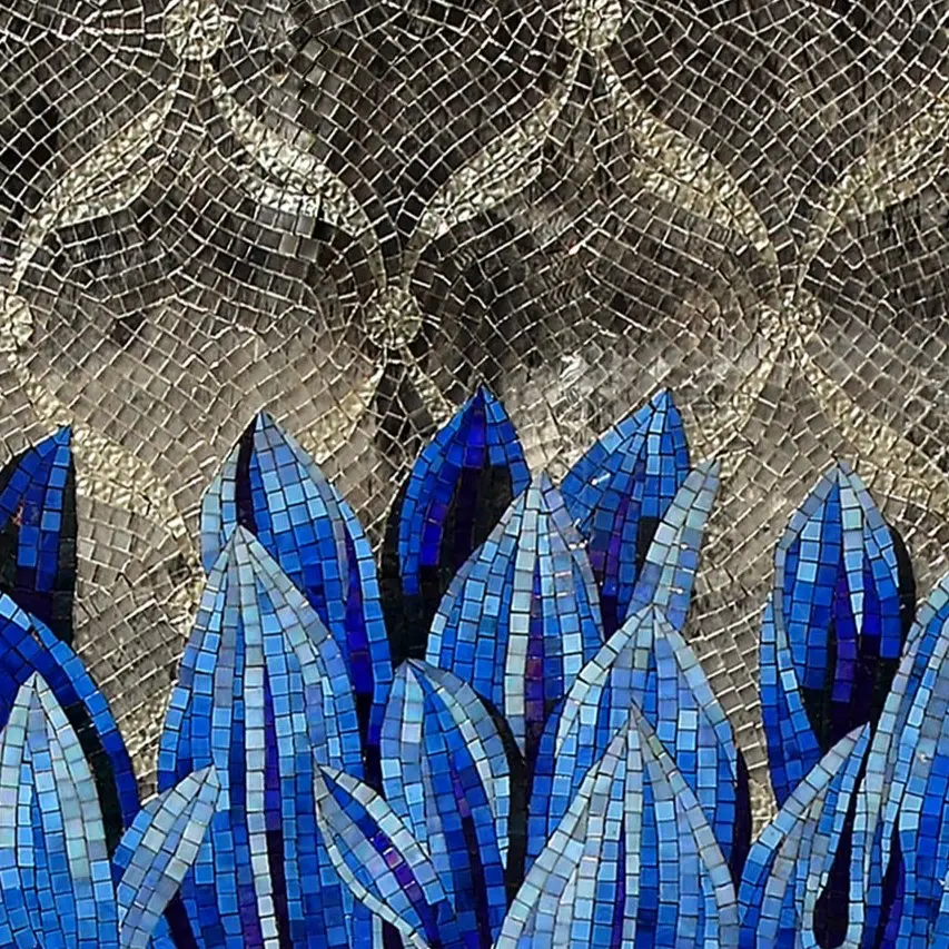 Green mosaic covering a bathroom, completing an elegant design.